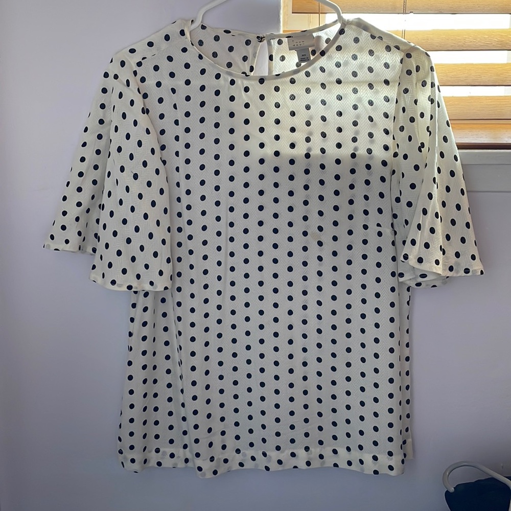 Cream color blouse with flutter sleeves